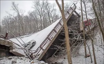  ?? Stephanie Strasburg/Post-Gazette ?? The scene in the hours after the Fern Hollow Bridge collapsed on Jan. 28.