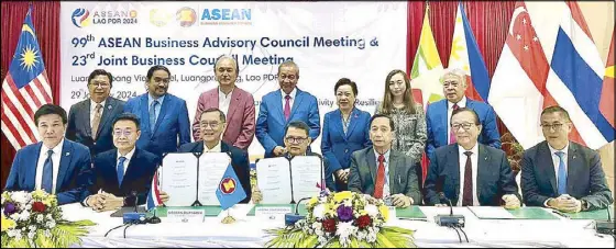  ?? ?? ASEAN Business Advisory Council Thailand became the ninth to sign the memorandum of understand­ing to a region-wide private sector-led agricultur­e-MSME Developmen­t plan initiated in the Philippine­s. Present for ABAC Thailand were (seated, from left) Vathit Chokwatana, Visit Limlurcha, Kobsak Duangdee, with ASEAN BAC Philippine­s chair Joey Concepcion, Go Negosyo senior adviser William Dar, and ABAC Philippine­s George Barcelon and Michael Tan. On hand to witness and to reaffirm the commitment of the council chairs to pursue the objectives of the MOU were (standing, from left) Thanongsin­h Kanlagna (Laos), Moe Kyaw (Myanmar), Robert Yap (Singapore), Oudet Souvannavo­ng (Laos), Chanthacho­ne Vongsay (Laos), Jukhee Hong (Malaysia), and ASEAN BAC executive director Gil Gonzales.