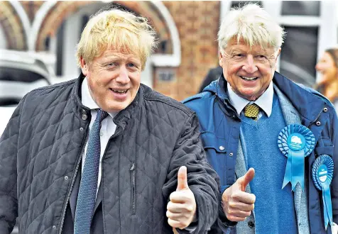  ??  ?? Home help: Boris Johnson is joined on the campaign trail in his Uxbridge constituen­cy by his father Stanley