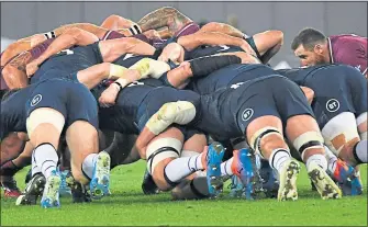  ??  ?? The Scotland scrum holds tight against the Georgians