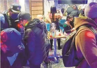  ??  ?? Dozens of partyers were caught smoking and drinking at an illegal club in a basement in Woodside, Queens, early Sunday. Sheriff’s deputies were met with “immediate violence” and needed FDNY to knock down door to get in.