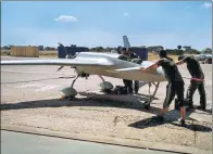  ?? PROVIDED TO CHINA DAILY ?? Technician­s from the China Academy of Aerospace Aerodynami­cs prepare a CH-3 unmanned aircraft for a prospectin­g flight in Zambia.