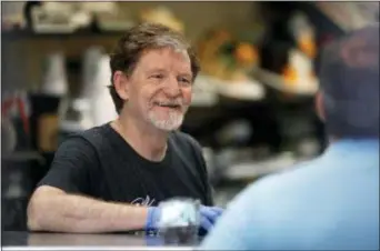  ?? DAVID ZALUBOWSKI — THE ASSOCIATED PRESS ?? Baker Jack Phillips, owner of Masterpiec­e Cakeshop, manages his shop Monday in Lakewood, Colo., after the U.S. Supreme Court ruled that he could refuse to make a wedding cake for a same-sex couple because of his religious beliefs did not violate...