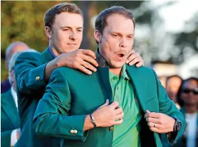  ??  ?? NIce threads: Danny Willett tries on the green jacket in 2016