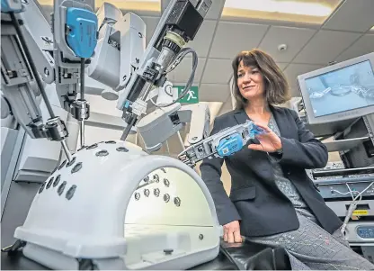  ?? Picture: Mhairi Edwards. ?? DIHS co-director Dr Vanessa Kay with the surgical robot.