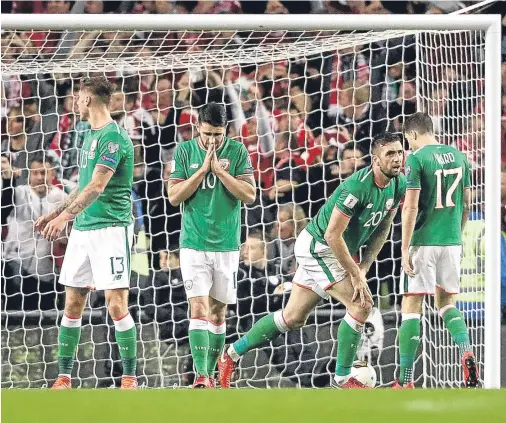  ??  ?? IT’S ALL OVER: Republic of Ireland’s Jeff Henrick, Robbie Brady, Shane Duffy and Stephen Ward after Denmark’s Christian Eriksen scores his side’s third goal at the Aviva Stadium last night