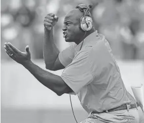  ?? BART BOATRIGHT/THE GREENVILLE NEWS ?? Clemson assistant coach Chris Rumph reacts after a defensive stop against North Carolina State on Nov. 14, 2009.