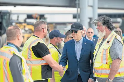  ?? NYT ?? President Joe Biden greets constructi­on workers at Pittsburgh Internatio­nal Airport in Pittsburgh, Pennsylvan­ia, on Wednesday.