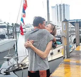  ??  ?? Lauren Leifeste welcomes her fiance Eric Bihl after he spent 882 days at sea.