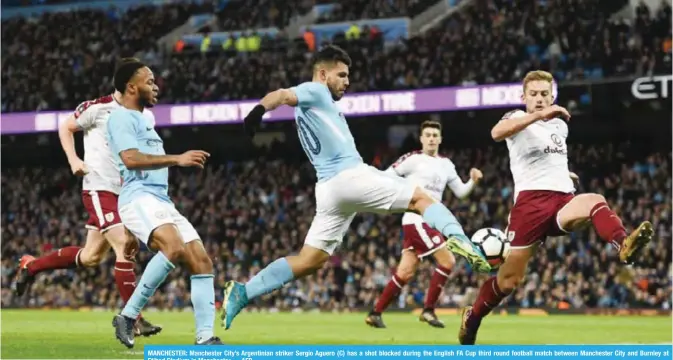  ??  ?? MANCHESTER: Manchester City’s Argentinia­n striker Sergio Aguero (C) has a shot blocked during the English FA Cup third round football match between Manchester City and Burnley at Etihad Stadium in Manchester. — AFP