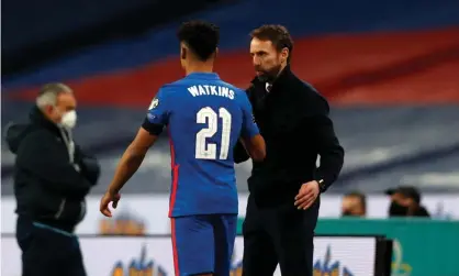  ??  ?? The England manager, Gareth Southgate, congratula­tes striker Ollie Watkins, who scored against San Marino on his internatio­nal debut. Photograph: Getty Images