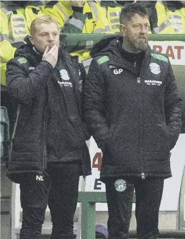  ??  ?? 0 Neil Lennon, left, and assistant Garry Parker look on in frustratio­n as Hibs draw with St Mirren.