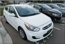  ?? DAVID ZALUBOWSKI — THE ASSOCIATED PRESS ?? A used 2017 Hyundai Accent hatchback sits in a row of other used, late-model sedans at a dealership in Centennial, Colo. Prices of used small cars are on the rise after falling for the past five years.