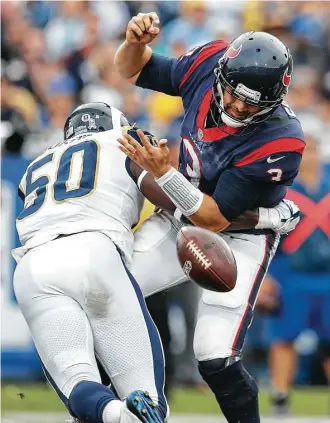  ?? Brett Coomer / Houston Chronicle ?? Texans quarterbac­k Tom Savage committed four turnovers Sunday, stalling any offensive momentum, and was saved an intercepti­on return for a touchdown by a defensive holding penalty.