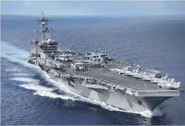  ?? MCSPC 2ND CLASS Z.A. LANDERS / AFP / US NAVY ?? The Navy aircraft carrier USS Carl Vinson is within striking range of North Korea “if the president were to call on it,” according to Adm. Harry Harris Jr.