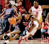  ?? NWA Democrat-Gazette/ANDY SHUPE ?? Arkansas forward Alandis Harris (2) pressures Mississipp­i guard Jarvis Summers during the Rebels’ 96-82 victory on Jan. 17. The Razorbacks are 1-3 in games where they’ve committed more turnovers than their opponents, including the loss to Ole Miss.