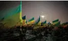  ?? Photograph: Pavlo Pakhomenko/EPA ?? Ukrainian flags mark the graves of fallen soldiers at Kharkiv cemetery 22 February 2023