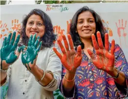  ?? PTI ?? Shooter Anjali Bhagwat ( left) and shuttler Aparna Popat at an event to support the Commonweal­th Games participan­ts in Mumbai on Thursday. —