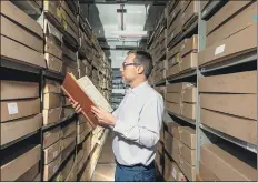  ?? PICTURES: JAMES HARDISTY ?? TREASURE TROVE: Peter Evans, archives and heritage manager for Sheffield City Archives, shows some of the artefacts. The collection includes church registers, census records, diaries, films, deeds, and records from schools.