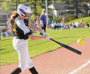  ?? Lori Van Buren / Times Union ?? Troy’s Emily Meyer hits the ball during a softball game against Bethlehem on Wednesday. Troy came up with just enough offense to edge Bethlehem, 2-1.