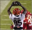  ?? CHARLIE RIEDEL — THE ASSOCIATED PRESS ?? Cincinnati Bengals wide receiver Tee Higgins makes a touchdown catch against Kansas City Chiefs safety Juan Thornhill during the second half of the AFC Championsh­ip game on Jan. 29 in Kansas City, Mo.