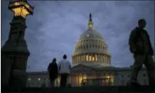  ?? J. SCOTT APPLEWHITE — THE ASSOCIATED PRESS FILE ?? In this file photo, lights illuminate the U.S. Capitol.