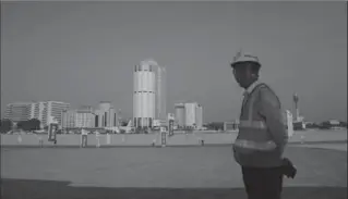  ?? ERANGA JAYAWARDEN­A, THE ASSOCIATED PRESS ?? A Chinese constructi­on worker stands on the land reclaimed from the Indian Ocean for the Colombo Port City project in Sri Lanka on Tuesday. It’s part of China’s ambitious One Belt One Road initiative.