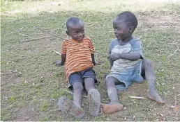  ??  ?? Children such as these playing in Nakasongol­a, Uganda, live in constant fear of being kidnapped and ritually sacrificed.