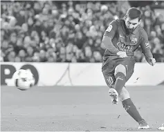  ??  ?? Barcelona’s Lionel Messi scores a goal during the Spanish Copa del Rey round of 16 second leg match against Athletic Club de Bilbao at the Camp Nou stadium in Barcelona. — AFP photo • Turn to Page 29 for story