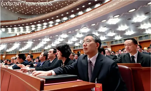  ??  ?? Deputies vote during the closing meeting of the Second Session of the 13th National People’s Congress (NPC) at the Great Hall of the People in Beijing on March 15, 2019.