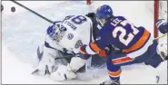  ?? JASON FRANSON - THE CANADIAN PRESS ?? Tampa Bay Lightning goalie Andrei Vasilevski­y (88) makes a save against New York Islanders’ Anders Lee (27) during third-period NHL Eastern Conference final playoff game action in Edmonton, Alberta, Sunday, Sept. 13, 2020.