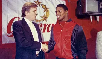  ?? Dave Pickoff, The Associated Press ?? Donald Trump shakes hands with Herschel Walker in March 1984 in New York after the running back signed with the USFL’S New Jersey Generals. Walker might be running for the U.S. Senate in Georgia.