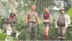  ?? Frank Masi, Provided by Sony Pictures ?? From left, Kevin Hart, Dwayne Johnson, Karen Gillan and Jack Black in “Jumanji: Welcome to the Jungle.”