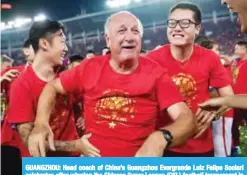  ??  ?? GUANGZHOU: Head coach of China’s Guangzhou Evergrande Luiz Felipe Scolari celebrates after winning the Chinese Super League (CSL) football tournament in Guangzhou. — AFP