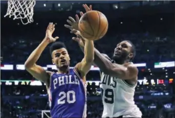  ?? THE ASSOCIATED PRESS FILE ?? Sixers guard Timothe Luwawu-Cabarrot, left, rebound in a game last February in Boston. battles the Celtics’ Jae Crowder for a