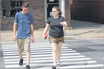  ?? ASHLEY THOMPSON ?? Pedestrian­s cross Webster Street in downtown Kentville on June 12.