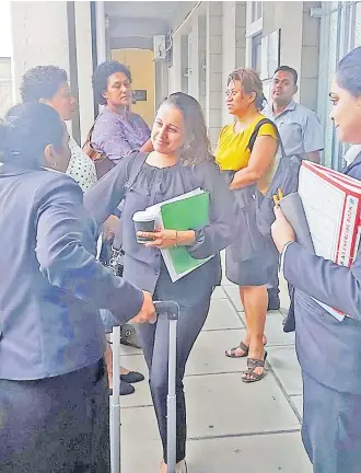  ?? Picture: VISHAAL KUMAR ?? Director environmen­t Sandeep Singh (centre) outside the Suva courthouse on Monday.