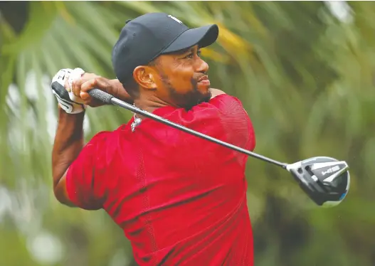  ?? MIKE EHRMANN/GETTY IMAGES/FILES ?? After four knee surgeries and four operations on his back, Tiger Woods has plenty of experience coming back to the Pro Tour after a prolonged layoff.