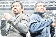  ?? — AFP photo ?? Filipino boxing idol Manny Pacquiao (centre L) poses for photograph­s with Argentina’s Lucas Matthysse (centre R) after a press conference in Kuala Lumpur on April 20, 2018, ahead of their world welterweig­ht boxing championsh­ip bout in July.