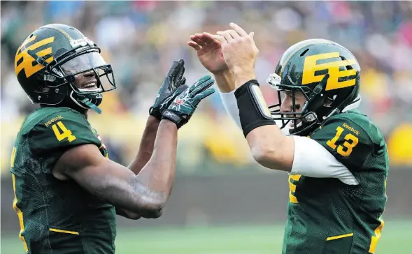  ?? ED KAISER /EDMONTON JOURNAL ?? Quarterbac­k Mike Reilly (13) and Adarius Bowman (4) are at the top of the rankings in the Eskimos’ Fight Club.