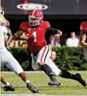  ?? BOB ANDRES / BANDRES@AJC.COM ?? Georgia freshman quarterbac­k Justin Fields brings another dimension to the Bulldogs offense with his running ability. He has 116 yards and three scores this season on 16 carries.