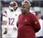  ?? MICHAEL AINSWORTH — THE ASSOCIATED PRESS ?? Commanders offensive coordinato­r Eric Bieniemy watches players warm up before a game against the Cowboys on Nov. 23 in Arlington, Texas.