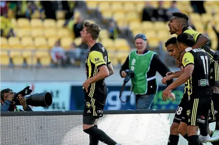  ?? PHILLIP ROLLO/STUFF ?? A fired up Alex Rufer celebrates Sarpreet Singh’s goal, which was later disallowed for handball.