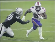  ?? THE ASSOCIATED PRESS ?? Buffalo Bills running back Devin Singletary carries the ball and is pursued by Las Vegas Raiders inside linebacker Cory Littleton during the second half of their Oct. 4game in Las Vegas. The Bills’ upcoming game against the Tennessee Titans has been reschedule­d because of of a COVID-19 outbreak among Titans players.