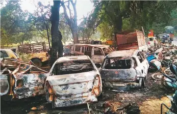  ?? PTI ?? Burnt vehicles that were set on fire by a mob in Monday’s violent clashes in Uttar Pradesh ■ over the alleged illegal slaughter of cattle in Bulandshah­r.