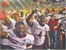  ?? AP PHOTO/PHIL SEARS ?? Jacksonvil­le State players celebrate after a 20-17 win against Florida State on Saturday.