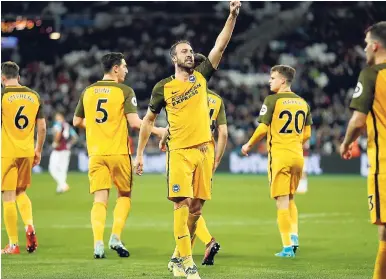  ?? AP ?? Brighton’s Glenn Murray (centre) celebrates after scoring his side’s third goal during the English Premier League against West Ham at London Stadium yesterday. Brighton won 3-0.