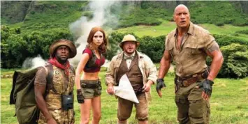  ?? FRANK MASI/SONY PICTURES ?? From left, Kevin Hart, Karen Gillan, Jack Black and Dwayne Johnson in a scene from “Jumanji: Welcome to the Jungle.”