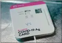  ?? ASSOCIATED PRESS ARCHIVES ?? Abbott Laboratori­es’ BinaxNow rapid COVID-19 test can now be sold without a prescripti­on for home use.