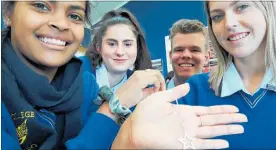  ?? Photo / Laurilee McMichael ?? From left: Courtney Constance, Petra White, Jack McNeill and Hannah Wade of Youth in Partnershi­p, with their fundraisin­g sterling silver pendant.